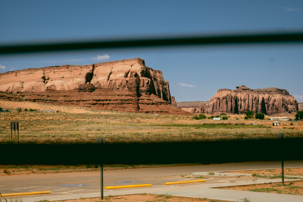 window blinds open with view of monument valley