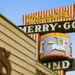Restaurant Sign called Margie's Merry Go with stripes and a carousel
