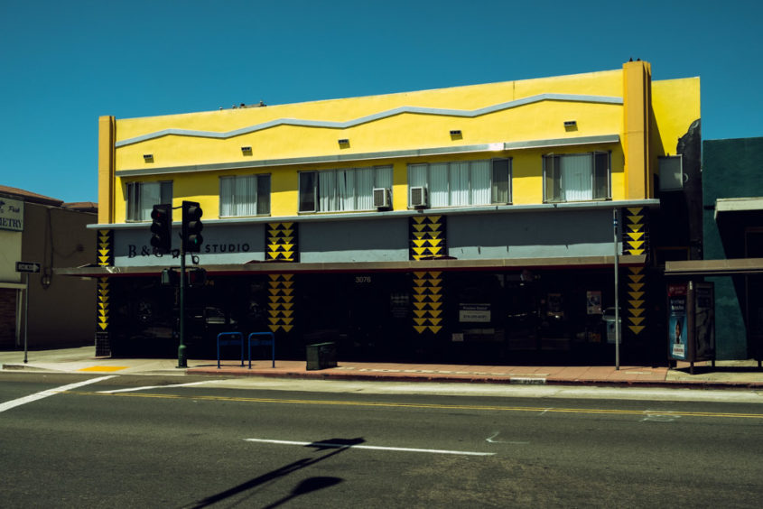 yellow building on empty street