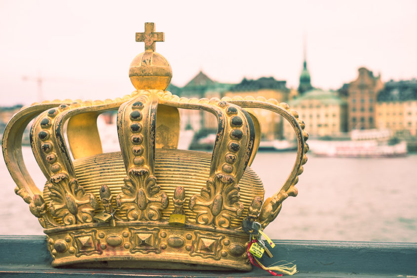 gold crown of the Sweden monarchy of the bridge with view of the city in the back